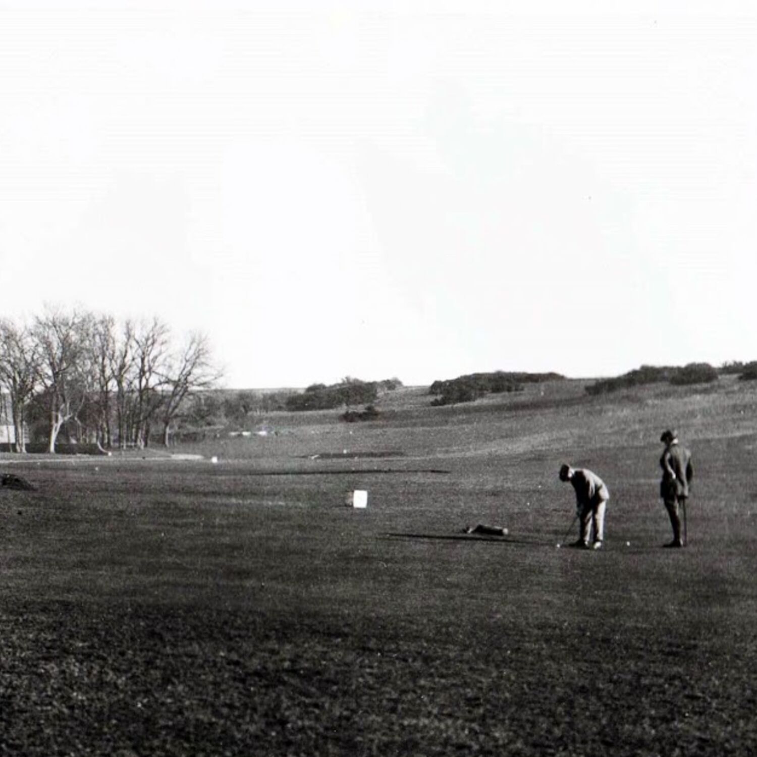 #caption-327 Putting on the nine hole course with the Clubhouse on the left and Broadwater Windmill on the right