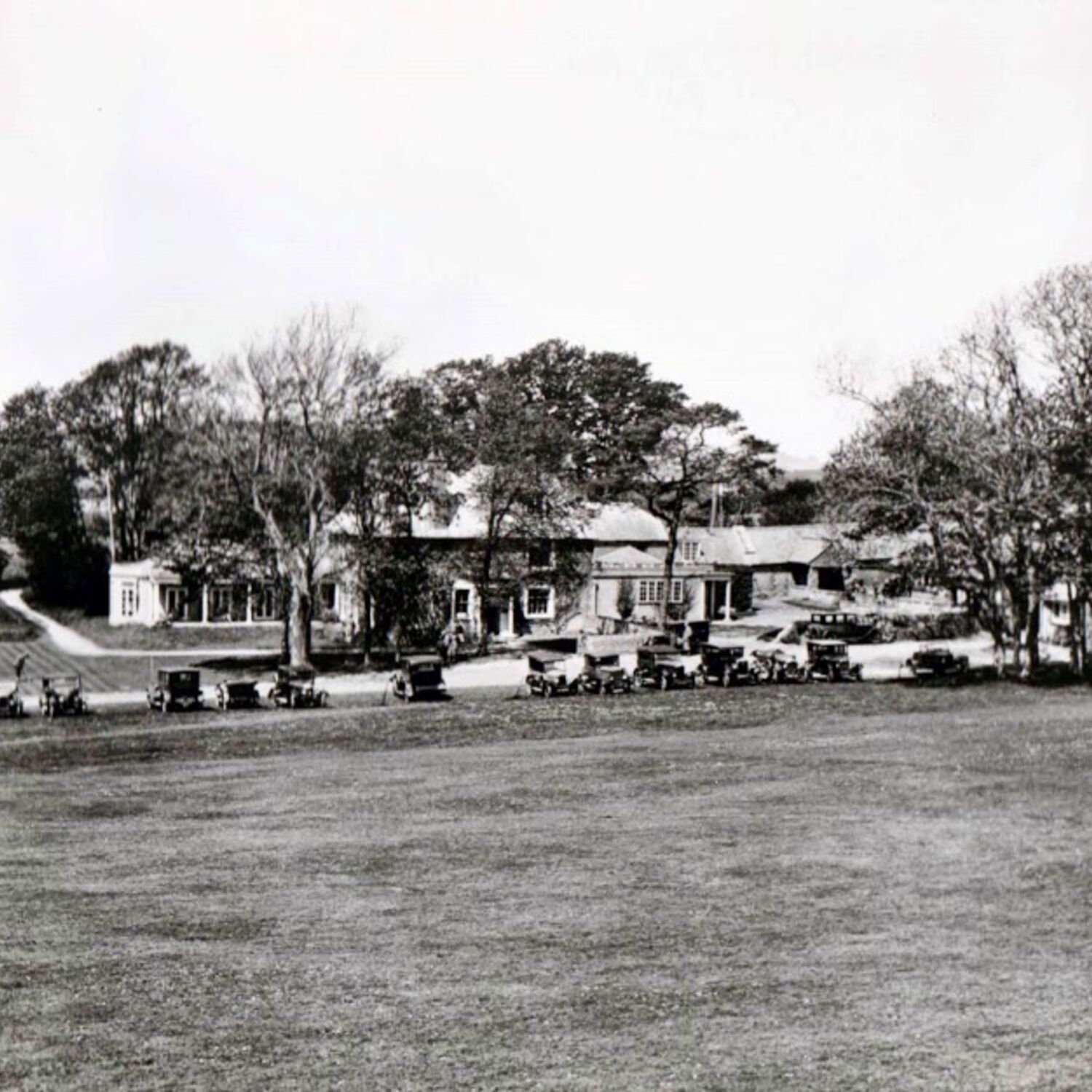 #caption-335 Cars parked on the grass outside the Clubhouse in 1927.