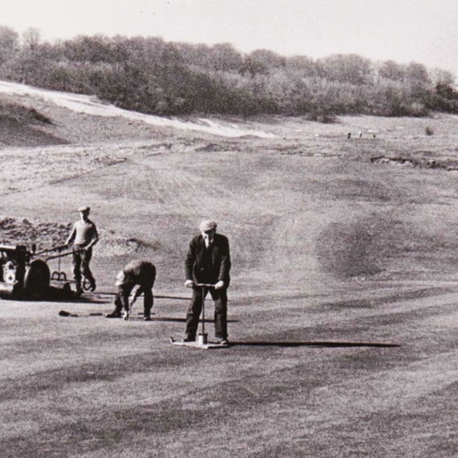 #caption-340 Fred Pratt cutting a new hole on the 12th, while Bill Denyer is working the Ransome overgreen mower.